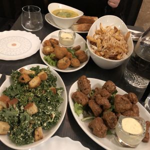 Appetizer testing: Asparagus soup, stuffed mushrooms, classic poutine, small kale Caesar, and agave garlic wings (all amazing) at The Vegan Hippie Chick in Welland