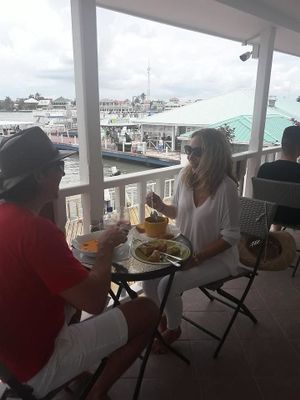 they also have a wrap around verandah with an awesome view of the Harbour with sailboats passing by. at Martha's Cafe Belize in Belize City