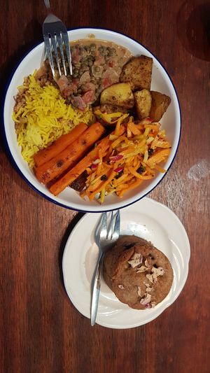 Lentil rice, lentil dal, roast carrot/potatoes and carrot/apple slaw, with a pear/blueberry cake on the side. at Big Fig in Wanaka