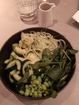 Super green salad - a huge amount of hummus topped with some greens, avocado and soy beans at Joma in Vienna