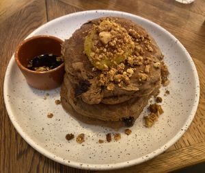 Chocolate chip pancakes: a bitter and sticky mess in my mouth. They put cocoa in the dough, the orange marmelade was too bitter and there was a lack of variety in texture and flavours. at Karibu Cafe in Utrecht