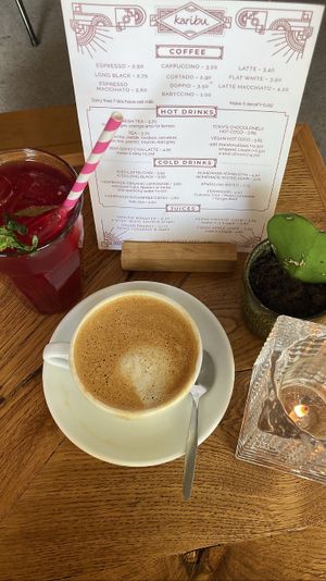 Flat white with oat milk and homemade kombucha   at Karibu Cafe in Utrecht
