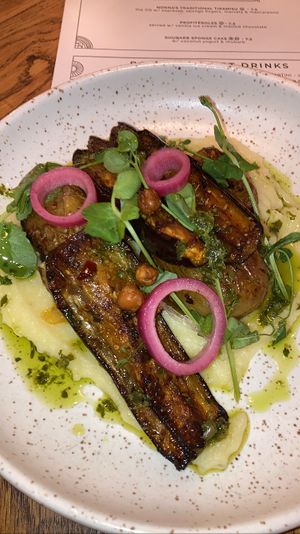 Skordalia (kinda like mashed potatoes) with roasted potatoes on top as well as eggplant, crispy chickpeas and some herbs. Yummy but rather oily  at Karibu Cafe in Utrecht