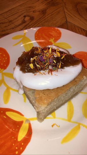 Sponge cake with coconut yoghurt and rhubarb compote. The star of the show   at Karibu Cafe in Utrecht