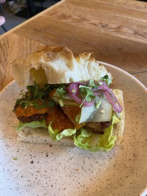 Vegan better butter no-chicken sandwich: tasty. It comes with tandoori and ‘kerrie’ sauce.   at Karibu Cafe in Utrecht