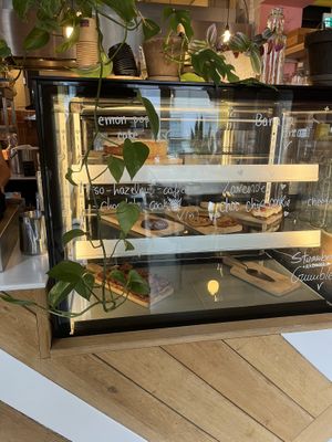 Pastry display, vegan sweets are clearly labeled  at Karibu Cafe in Utrecht