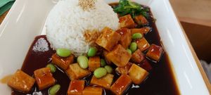 Tofu with a sweet sauce, edamame and rice. at Cafe im Kunstmuseum in Vaduz
