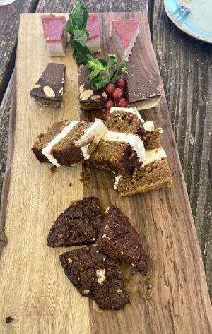 Third round high tea: strawberry cheesecake, date-pinda bars, carrotcake and chocolate cookies  at Black & White Kafe in Breda