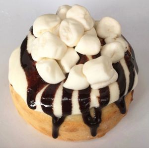 Orange Creamsicle Roll made with Orange Cream Frosting, Marshmallows, and Chocolate Sauce!  at Cinnaholic in Henderson
