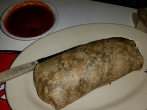vegan burrito with sauce on the side at Swinger's Diner in Santa Monica