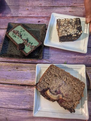 All the cakes. Delicious but don't think the banana bread (bottom right) was meant to be raw in the middle!? at The Vegan Shack in Richmond