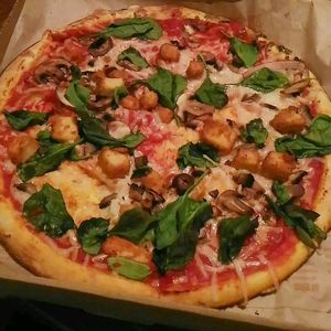 vegan pizza with vegan cheese, popcorn chickn, spinach and mushrooms.  at Blaze Pizza in Henderson