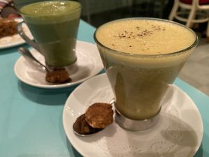 Two soy lattes: turmeric-ginger and matcha  at Privé - Keppel Bay in Central Singapore