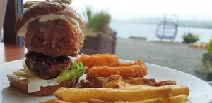 Vegan Burger;
Our vegan burger just got better.
Crispy fried sweet potato and a panko crumbed macaroni patty, served on a pretzel bun with tomato, lettuce, pickle, mayo and sauce. at Creagan Inn in Appin