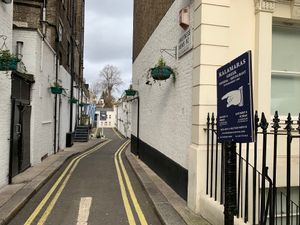Down a side street with Greek flag at Kalamaras in West London
