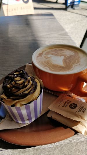 Vegan cupcake and latte at Suburban West End in South Brisbane
