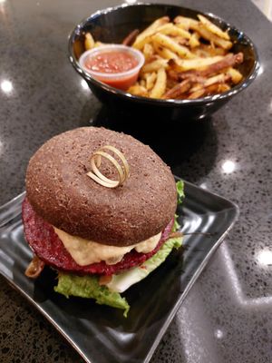The Delux Burger with fries at Copper Branch in Edmonton