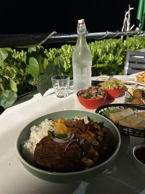 Vegan katsu curry, side beans, side pasta, risotto balls and spring rolls  at Darwin Trailer Boat Club in Fannie Bay