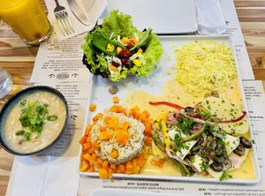 Full meal of the day. Bean soup with smoked tofu, super fresh salad, ‘bacalhoada’, Ane coconut ‘farofa’. And mango juice . at Vida Bistro in Rio De Janeiro