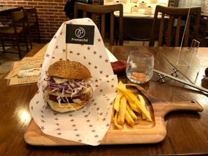 tempeh burger with banana chips and fries on the side at Premarché Alternative Diner in Kyoto