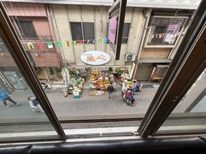 View of market across the street  at Premarché Alternative Diner in Kyoto
