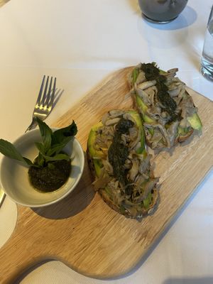 Avo, oyster mushrooms and sweet basil pesto on toast.  at The Flock Cafe in Siem Reap