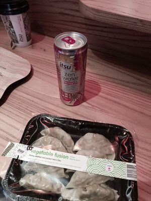 Gyoza with dipping sauce and zen water at Itsu - Neal St in London