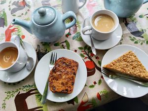 Tea loaf, ginger flapjack and tea with oat milk at Scarthin Books Cafe in Cromford