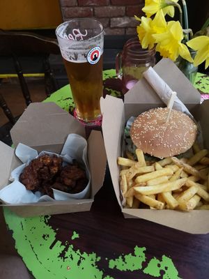 Dirty burger and fries with spicy cauliflower wings. at Le Pub in Newport