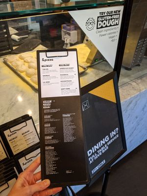 Menu and fresh dough being prepared at &pizza - F St NW in Washington