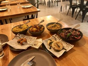 Coconut rice, potatoes, chickpea curry, eggplant dish, vada & coconut roti at Spice Garden in Nightcliff
