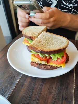 FERMENTO BAGEL (V)
$14.00
frittata with onion, potato, spinach and tomato inside

topped with melted mozzarella , tomato, AVOCADO on sourdough (they were out of bagels) at Fermento in Long Beach