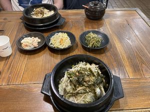 An order of two mushroom & tofu bibimbap with side dishes.  at Dubuga Tofu Go - Bibimbap Restaurant - 두 부가 in Busan