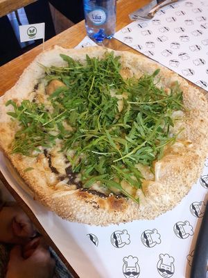 White pizza with vegan mozzarella, black truffle and rucola at Mister Pizza - Duomo in Florence