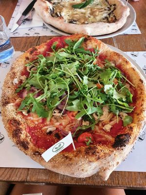 Sesame dough, Vegan mozzarella,  mushroom, onion , pomodori,  rucola at Mister Pizza - Duomo in Florence