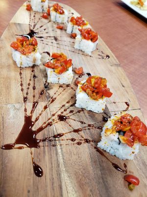 Sp tuna-to roll! 🔥🔥🔥

Inside: cumcumber, avocado, sweet yam tempura 
Top: sp tomatoes mix 
Sauce: teriyaki sauce  at Blufin Sushi in Fresno