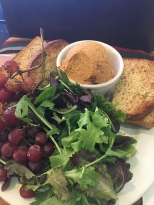 $14 cheese plate-ball of plain ground cashews, dry lettuce and grapes  at Flore in Los Angeles