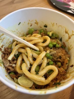 Katsu curry stir fry style udon noodles with added veggie meatballs   at Itsu - Wimbledon in South West London