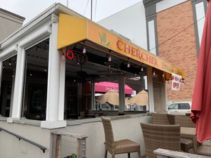 Outdoor seating in the open and under the overhang at CherCher Ethiopian Cuisine in Bethesda