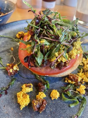 Vegan egg and bacon roll  at Amongst Few in Dubai