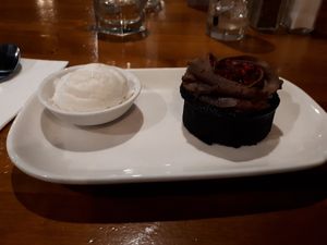 Chocolate mud cake with vanilla icecream - vegan and tasty. at Speights Ale House in Invercargill