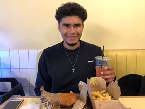 Me posing with food   at Rudy's Dirty Vegan Diner in North West London