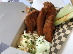 Buffalo chicken wings with slaw and blue cheese sauce at Rudy's Dirty Vegan Diner in North West London