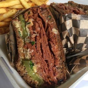 Seitan pastrami sandwich! Has pickles, and sauerkraut! Really filling! at Rudy's Dirty Vegan Diner in North West London