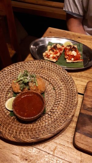 Sesame cravkers with mango romato topping. Pumpkin patties with tasty dipping sauce! at Pituq Cafe in 