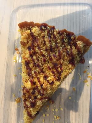 Delicious homemade crumble with lemon and abricose. Nice taste with red pepper on top. You should try it! at Organic Vision in Oostende