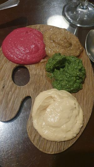 Tabla de pates, remolacha, garbanzo, espinaca con ajos tiernos, cebolla caramelizada con setas y nueces at La Lluna in Valencia