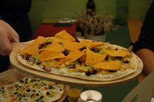 GS7 Hot Chilli Vegan (with vegan cream, vegan chicken fillet, sweetcorn, kidney beans, guacamole, hot chilli tortilla crisps, and chilli flakes) at Flammerie Alt-Saarbrücken in Saarbrucken