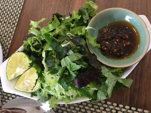 side herbs and spices for the vegan noodle hanoi soup at Om Vegan Garden in Hanoi