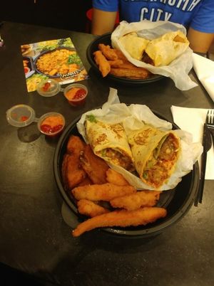 Sweet potato fries, spiced wedges, quinoa pizza wrap and jerk wrap at Marees Sauces and Food in London